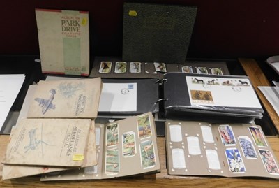 Lot 2210 - Various albums of cigarette cards.