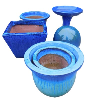 Lot 887 - A group of blue glazed plant pots, together...