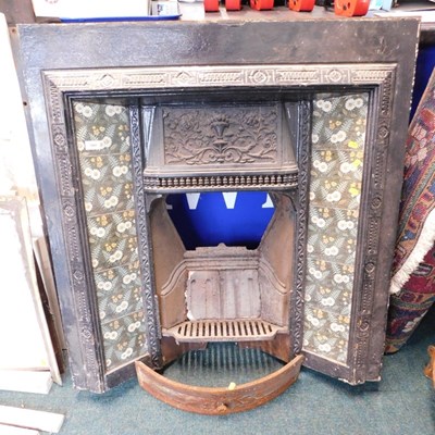 Lot 1691 - A Victorian cast iron and tiled fireplace...