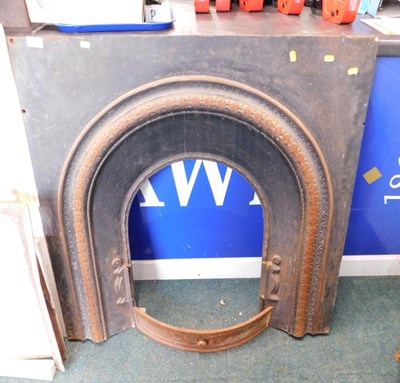Lot 1692 - A Victorian cast iron fire insert, 98cm wide.