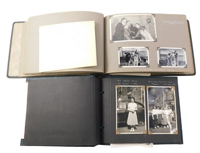 Lot 897 - Two mid 20thC photograph albums, containing...
