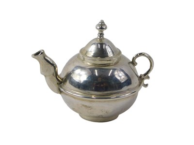 Lot 75 - A Dutch silver miniature teapot, of compressed...