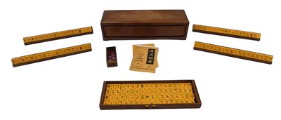 Lot 936 - An Oriental mah-jong set, with simulated ivory...