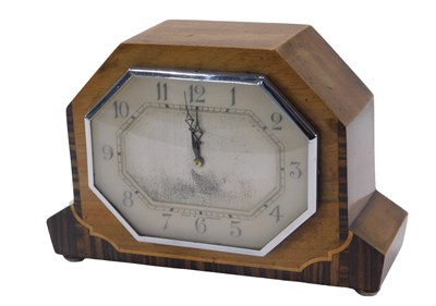 Lot 941 - An Art Deco mantel clock, in walnut and...