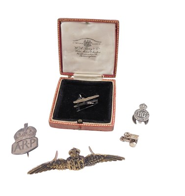 Lot 981 - A white metal brooch, modelled in the form of...