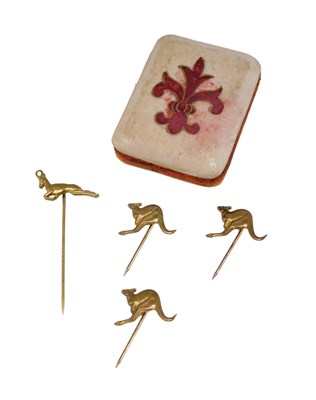 Lot 987 - A set of three gilt metal stick pins, each...