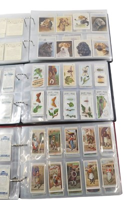 Lot 923 - Three albums containing cigarette cards, to...