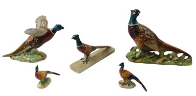 Lot 931 - A group of Beswick pheasants, comprising model...