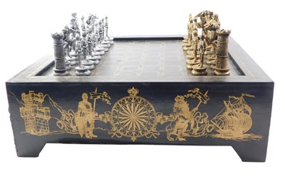 Lot 935 - A 20thC chess set, the board black leather...