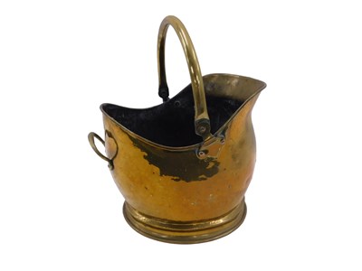 Lot 1037 - A brass helmet shaped coal scuttle, with swing...