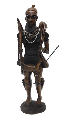 Lot 1042 - An African tribal figure of a hunter and...