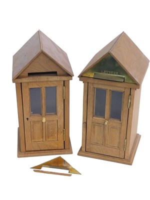 Lot 1086 - A pair of modern oak and brass message boxes,...