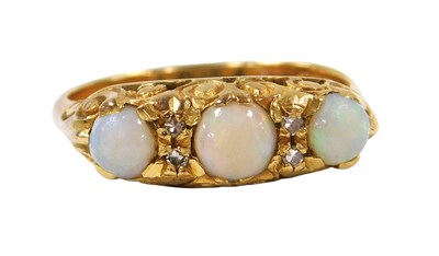 Lot 209 - An 18ct gold and opal three stone ring, set...