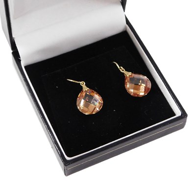 Lot 217 - A pair of champagne cz drop earrings, of...
