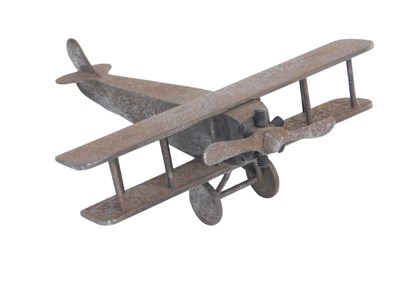 Lot 1117 - A steel scale model of a biplane, stamped...