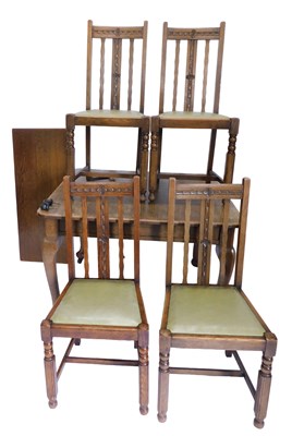 Lot 1158 - An early 20thC oak extending dining table, on...