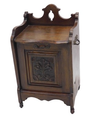 Lot 1162 - An Edwardian walnut coal purdonium, with...