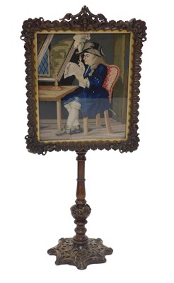 Lot 1163 - A 19thC pole screen, the frame carved with...