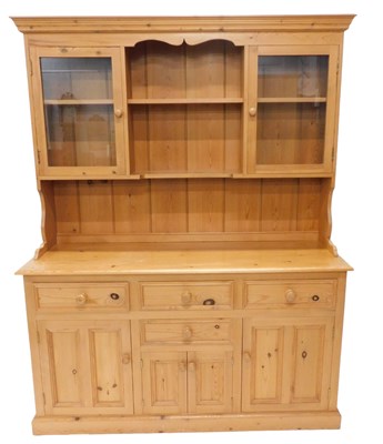Lot 1132 - A pine dresser, the raised back with two...