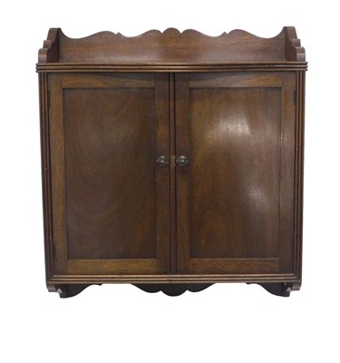 Lot 1140 - An Edwardian mahogany wall cabinet, with two...