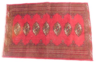 Lot 1172 - A Persian rug, with a design of medallions, on...