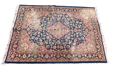Lot 1173 - A machine woven carpet, with a design of...
