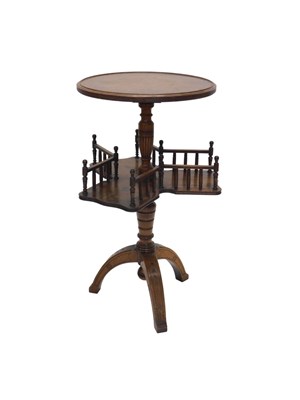 Lot 1179 - A late Victorian walnut dumb waiter, with a...