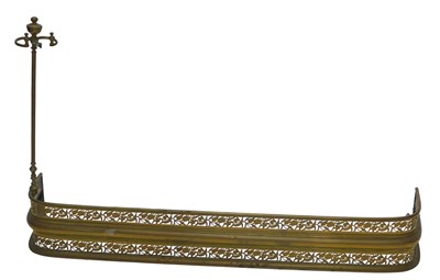 Lot 1188 - A 19thC pierced brass fender, with raised...