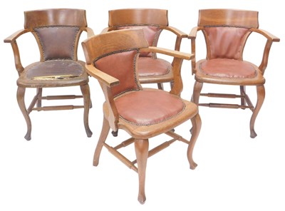Lot 1194 - A set of four early 20thC oak office chairs,...
