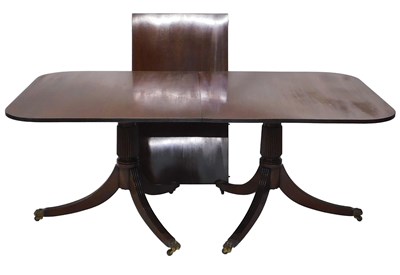 Lot 1199 - A Regency style mahogany dining table, the...