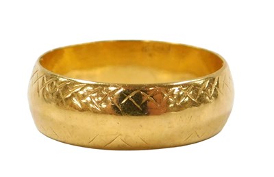 Lot 206 - A 22ct gold wedding band, with engraved...