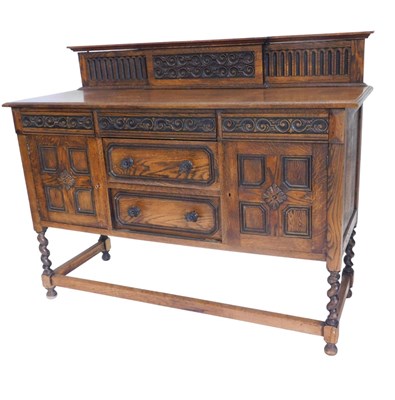 Lot 1222 - A 1920s carved oak sideboard, with a raised...