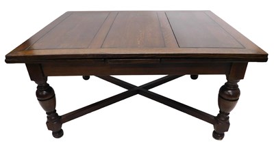 Lot 1229 - A large oak draw leaf table, the rectangular...