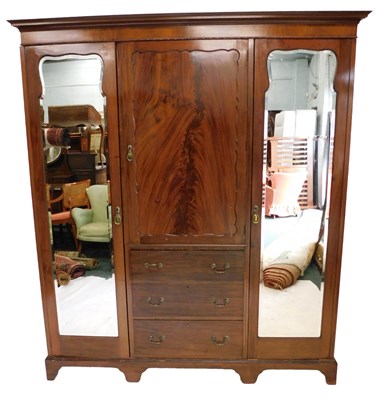 Lot 1231 - An Edwardian mahogany triple wardrobe, with...