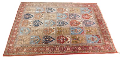 Lot 1238 - A Persian Qum carpet, with a design of flowers...