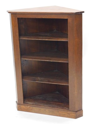 Lot 1247 - An oak standing corner cabinet, with three...