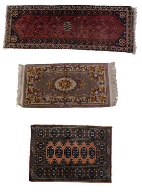 Lot 1292 - A small Persian rug, with an overall geometric...