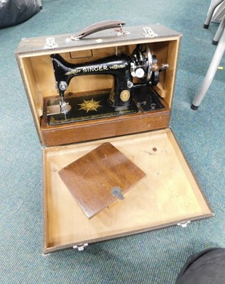 Lot 2084 - A cased Singer sewing machine, serial number...