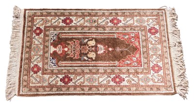 Lot 1293 - An Eastern prayer rug, with a Mihrab, and...