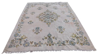 Lot 1297 - A large Indian carpet, with a foliate and...