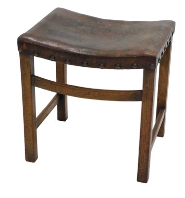 Lot 1152 - A late 19th/early 20thC oak stool, the concave...