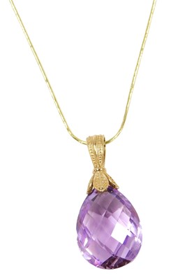 Lot 513 - A 9ct gold and amethyst drop pendant, on a...