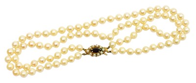 Lot 503 - A two strand cultured pearl necklace, with...