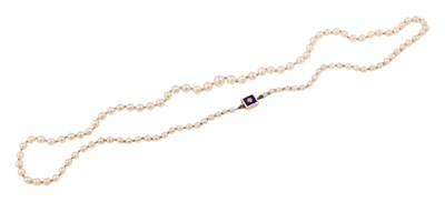 Lot 509 - A single row pearl necklace, set with one...
