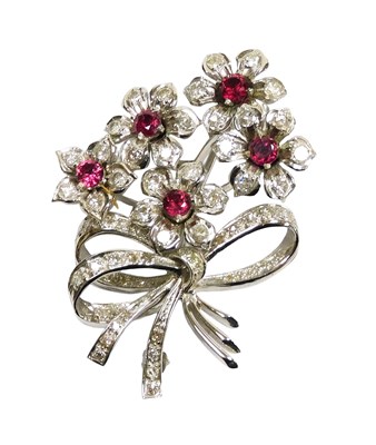 Lot 19 - An 18ct gold ruby and diamond flower brooch,...