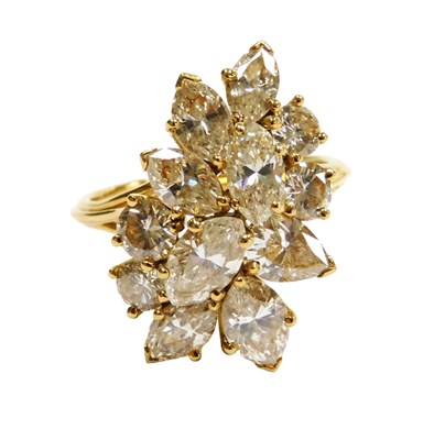 Lot 419 - An 18ct gold diamond cluster ring, set with...