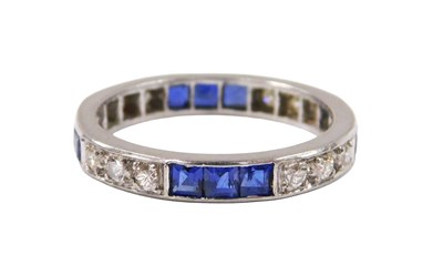 Lot 507 - A sapphire and diamond full eternity ring, set...