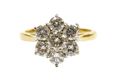 Lot 417 - An 18ct gold diamond cluster ring, the central...