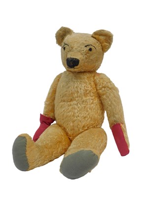 Lot 528 - A blonde Teddy bear, with felt pads and...