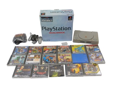 Lot 532 - A Sony PlayStation with DualShock controller...